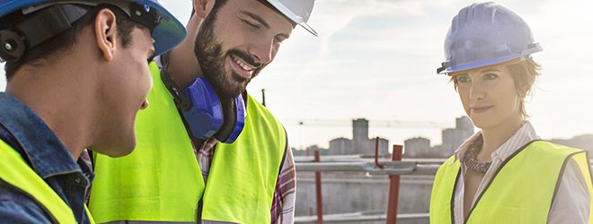 Construction architect contractor GM looking over blue print